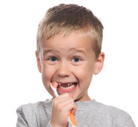 Boy cleaning teeth